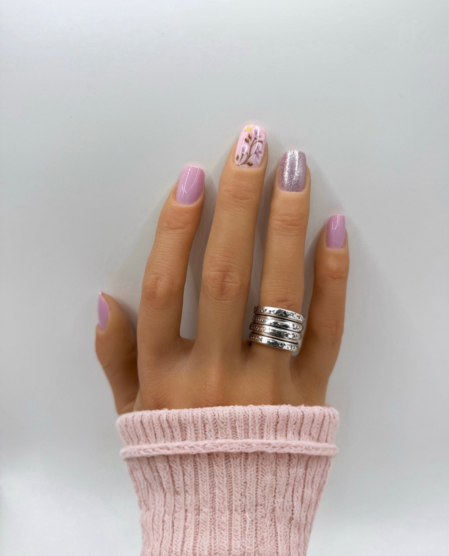 Hand wearing Heirloom Rose press-on nails – medium square blush pink nails with subtle shimmer finish