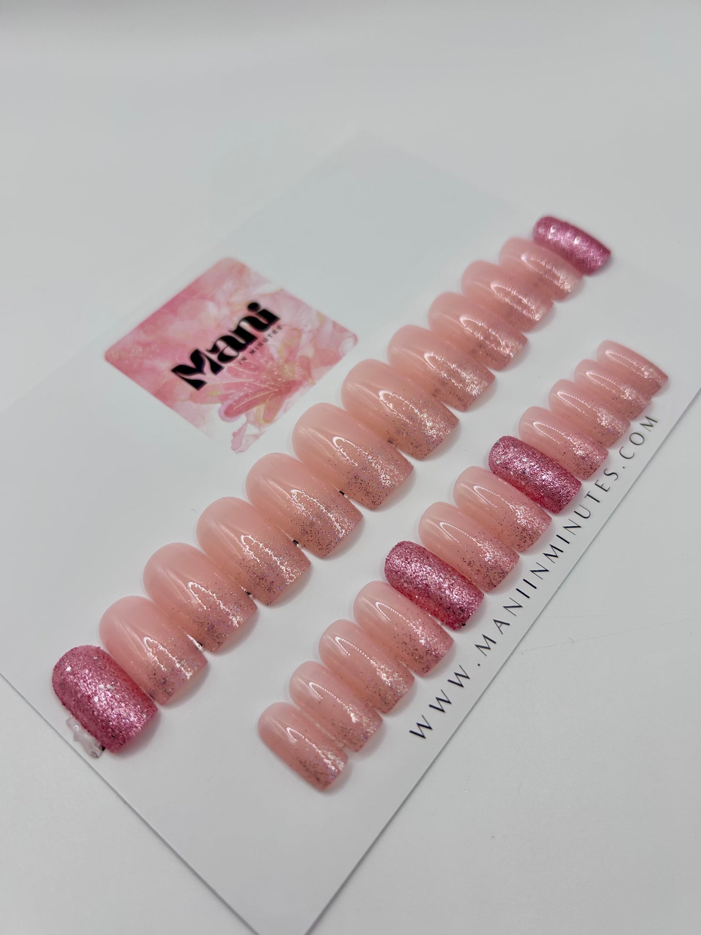 Pink Fizz glitter press-on nails displayed on Mani in Minutes branded card.
