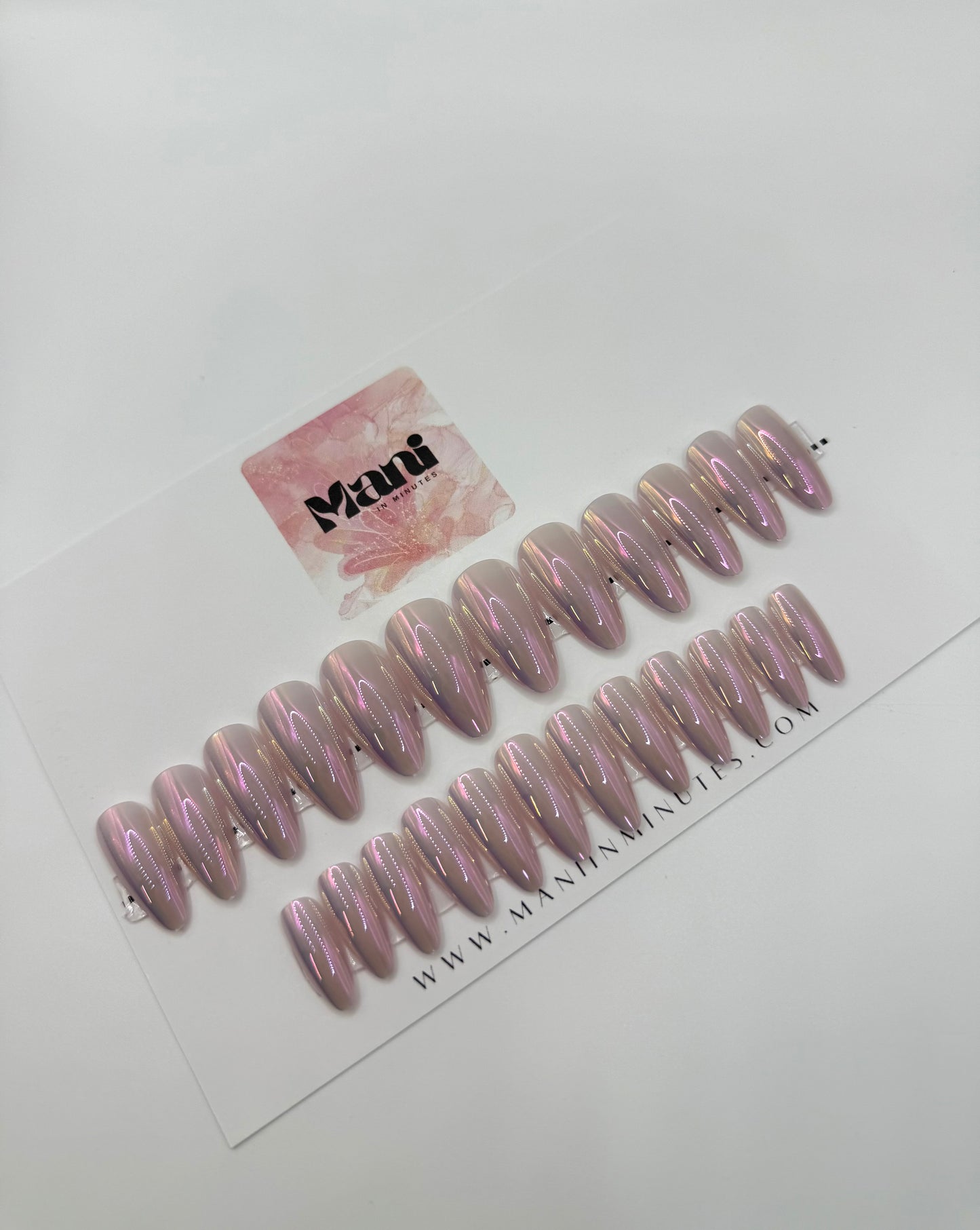 Opal Aura nail set displayed on Mani in Minutes branded card – iridescent almond nails