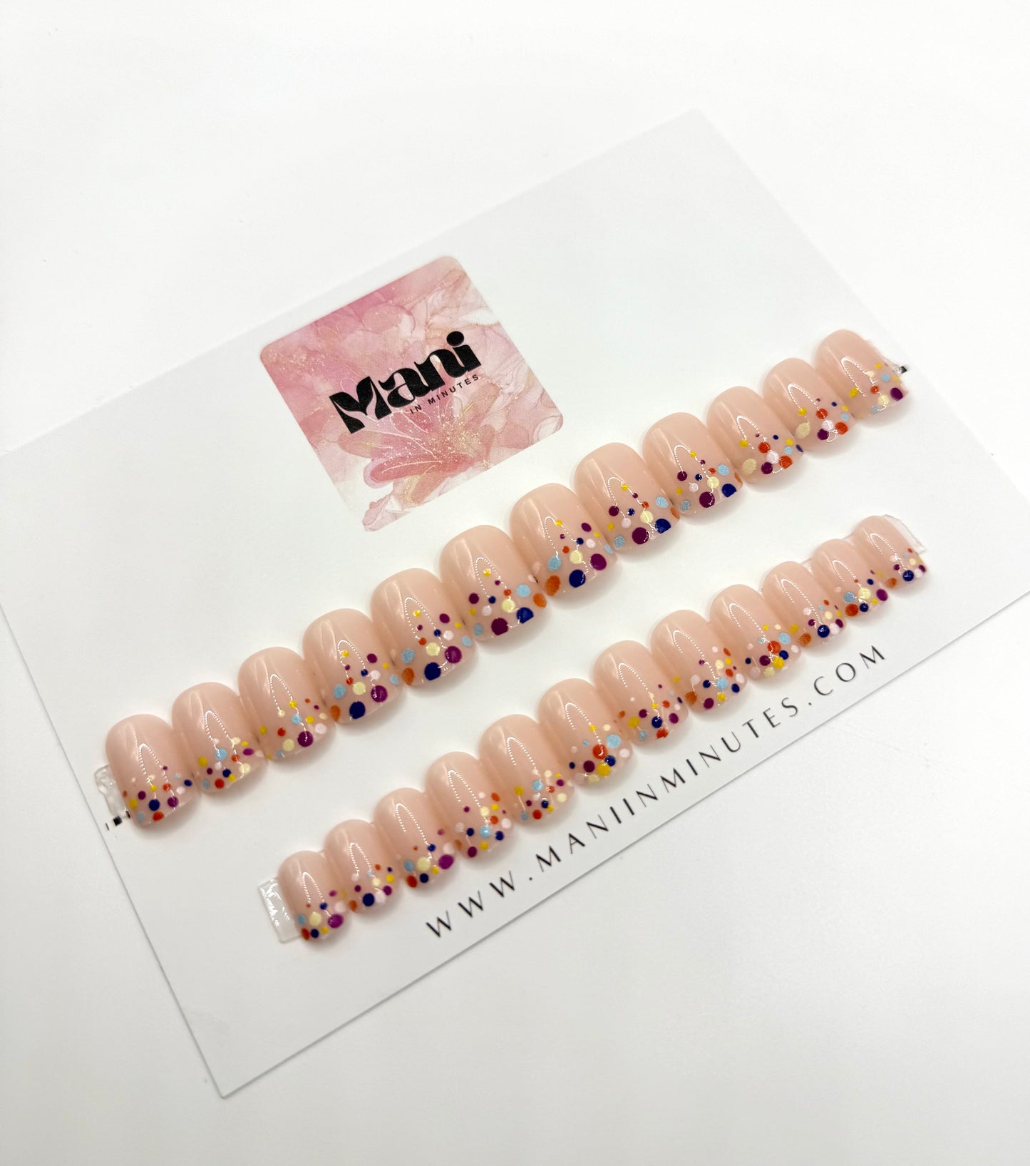 Confetti Pop nail set displayed on Mani in Minutes card – short square nude nails with bright confetti tips