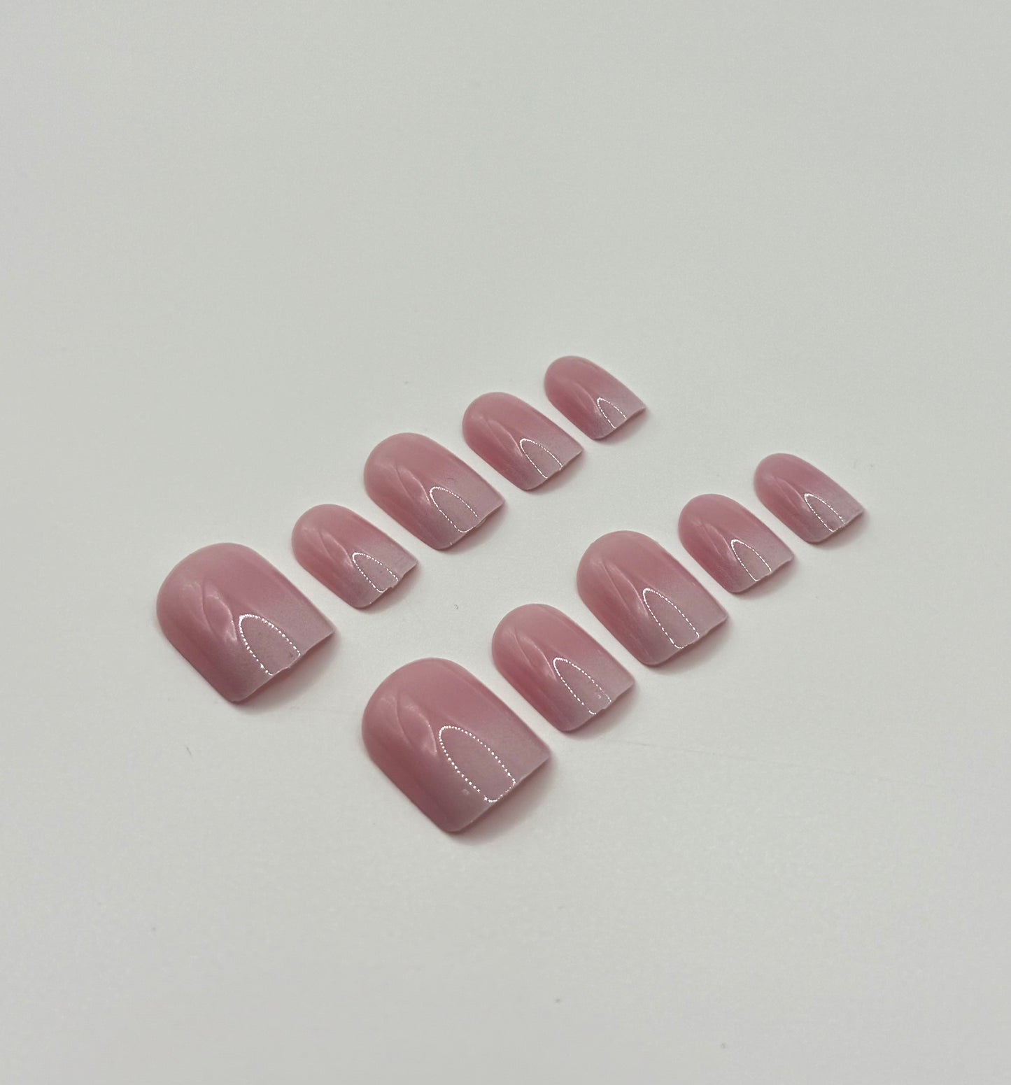 Close-up of Subtle Pink Ombre press-on nails showing delicate blush to pink fade