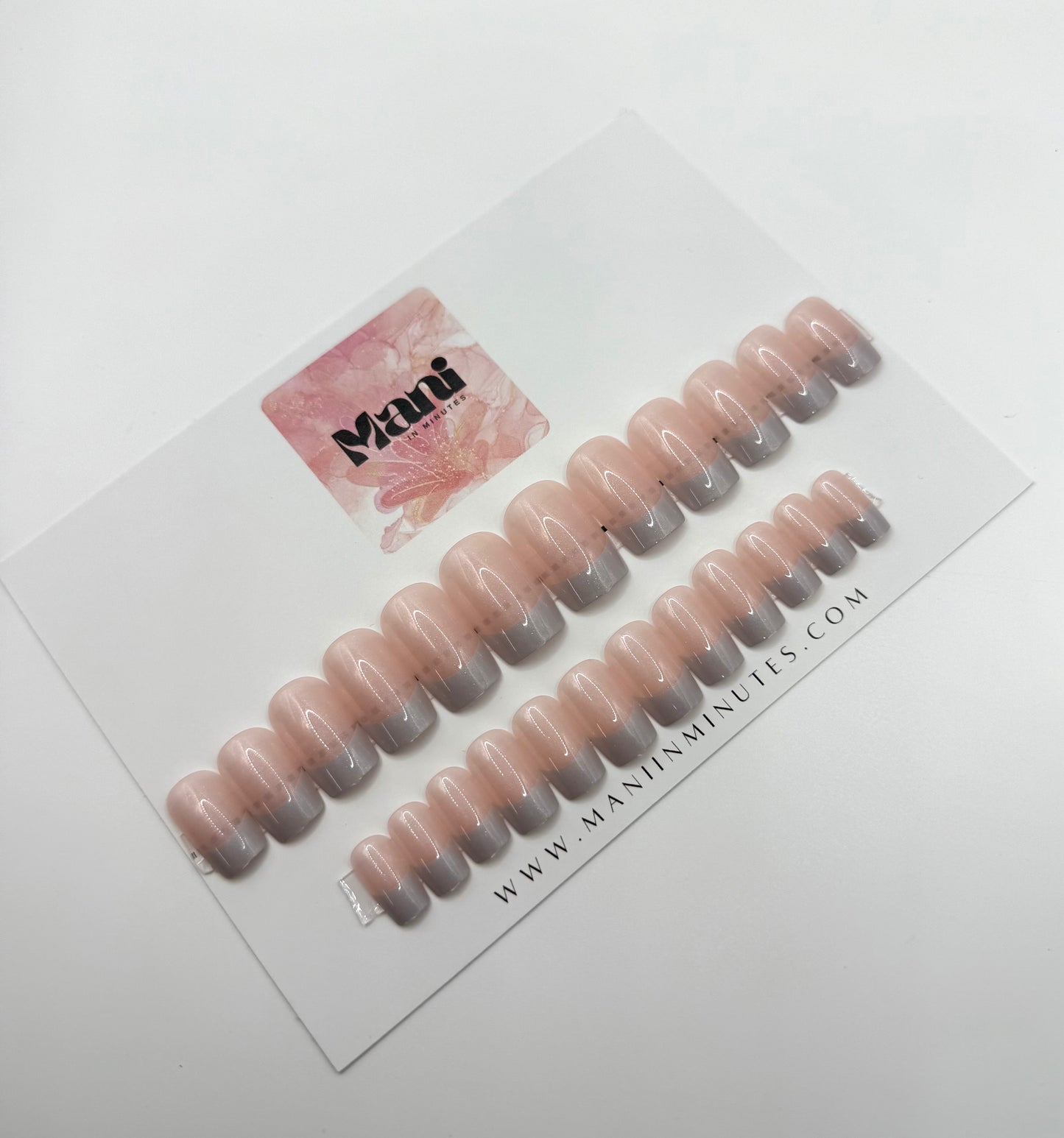 French Frost nail set displayed on Mani in Minutes card – sheer pink press-ons with white frosty French tips