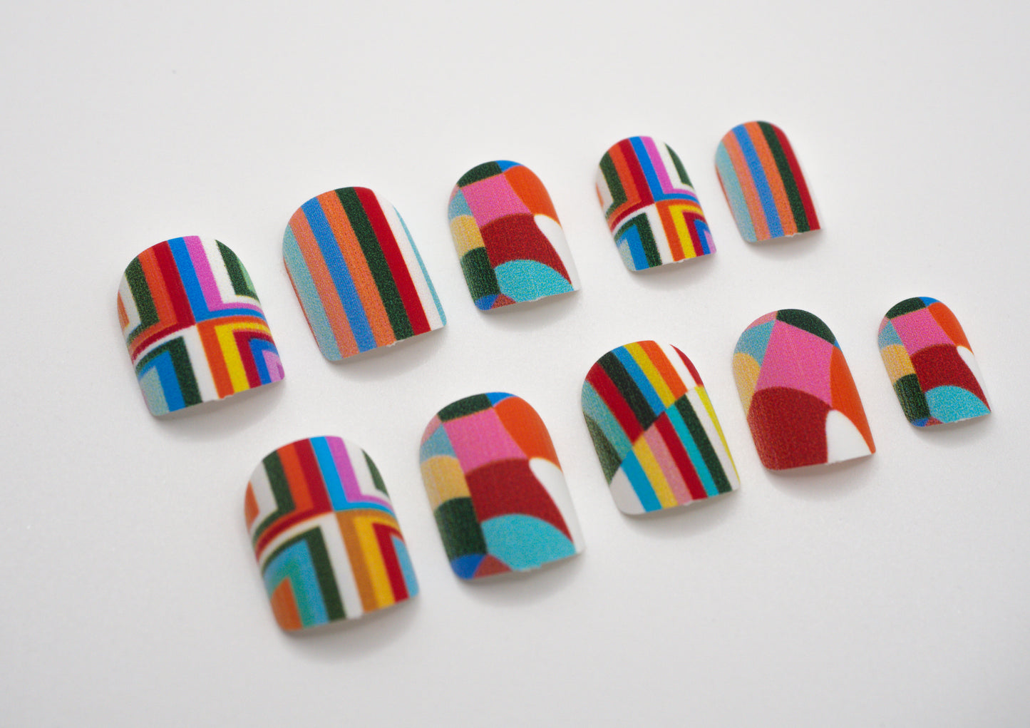 Geometric Glam press-on nails – bold rainbow geometric design by Mani in Minutes