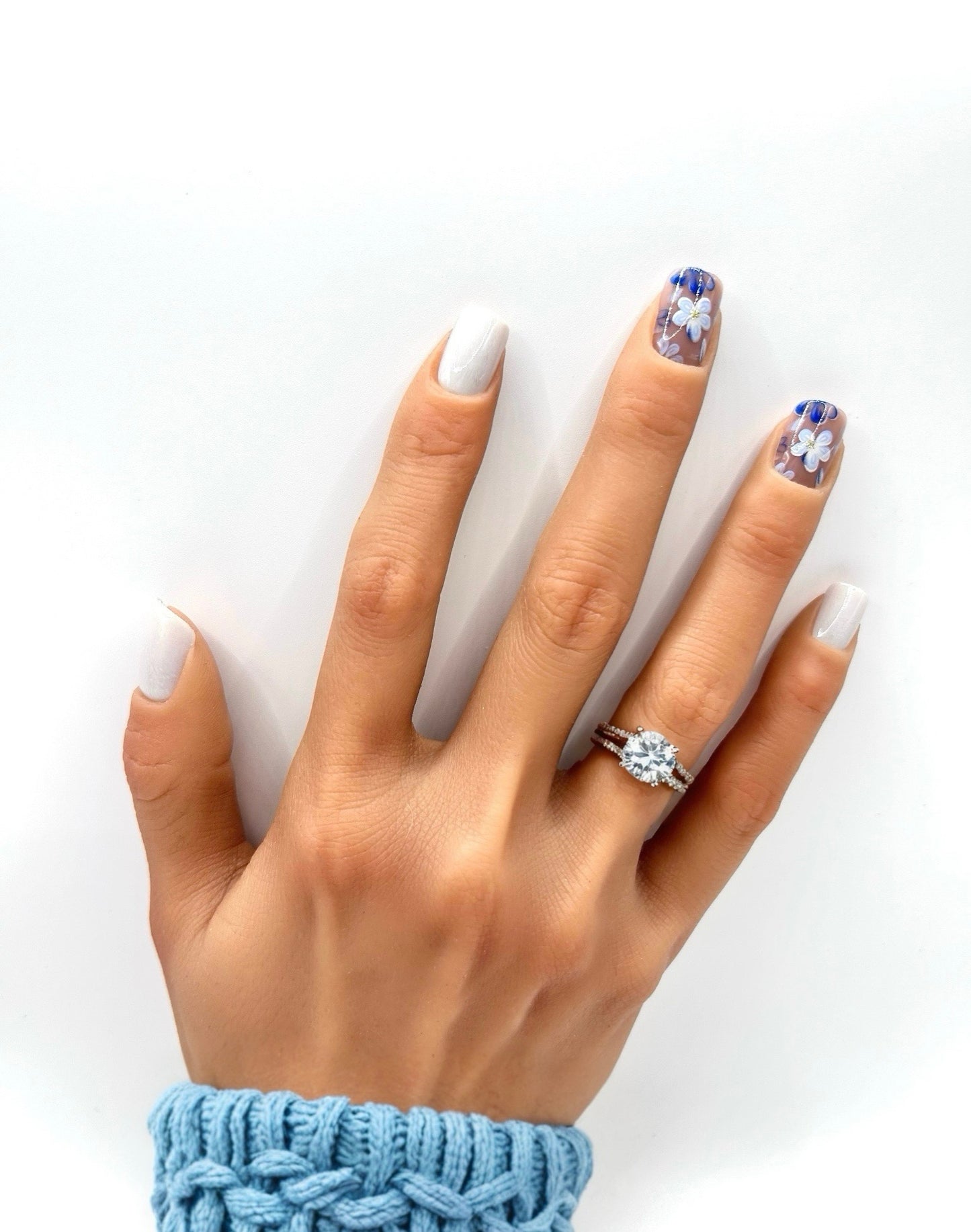 Azure Bloom nails on hand – reusable short square floral press-on nails by Mani in Minutes
