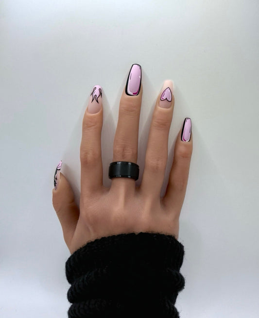 Cartoon style press-on nails with hearts, flames, and bold outlines