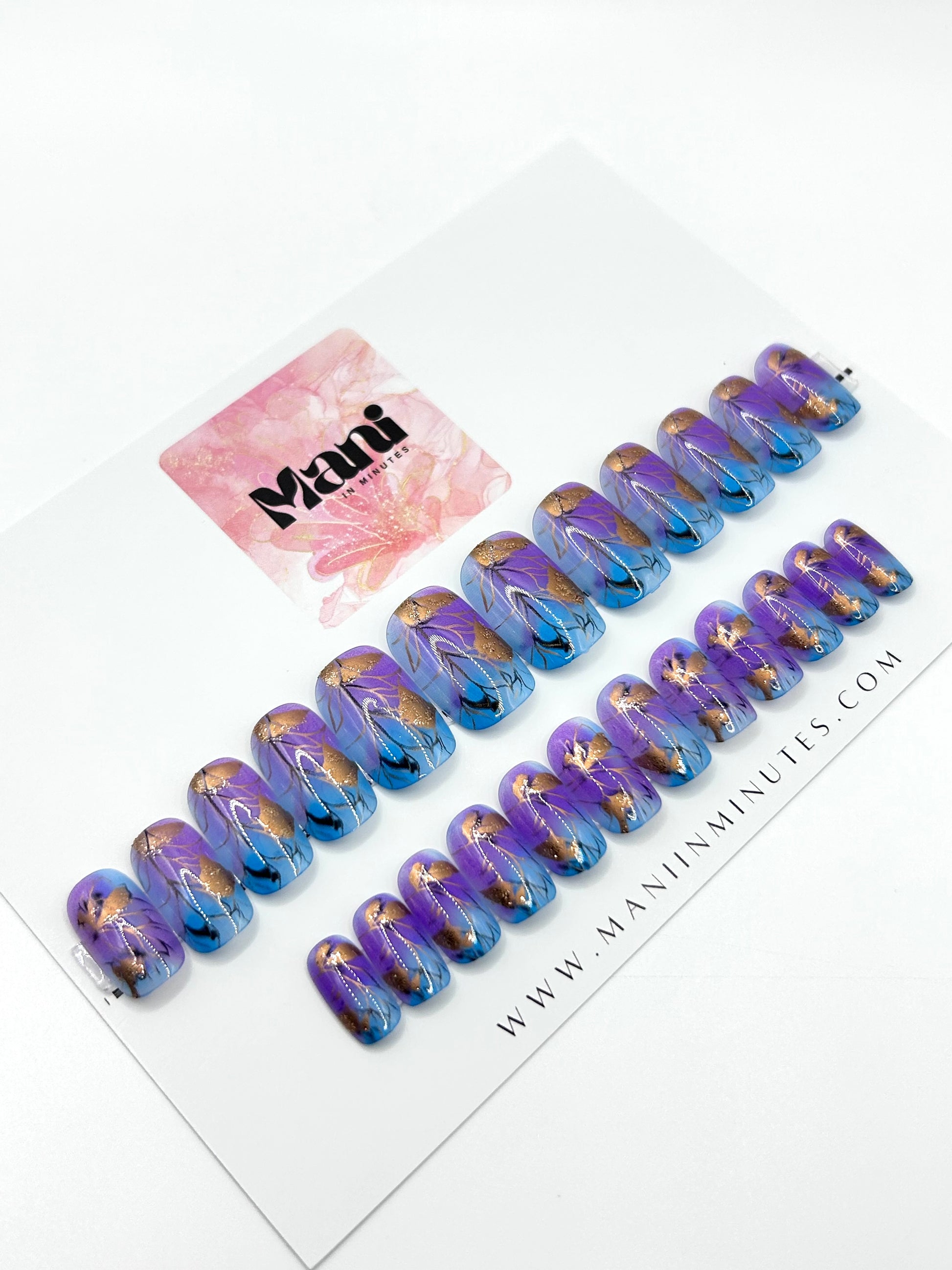Fleur de Luxe press-on nails arranged on Mani in Minutes branded card.