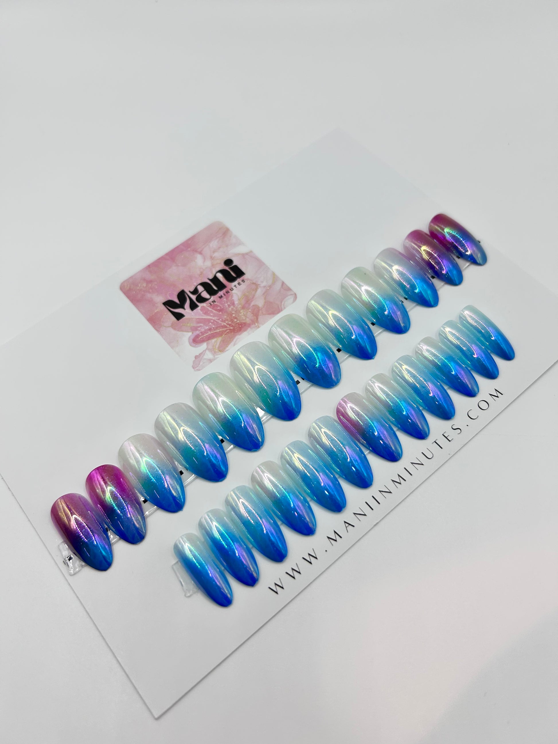 Aurora Glow iridescent press-on nails displayed on branded Mani in Minutes card.