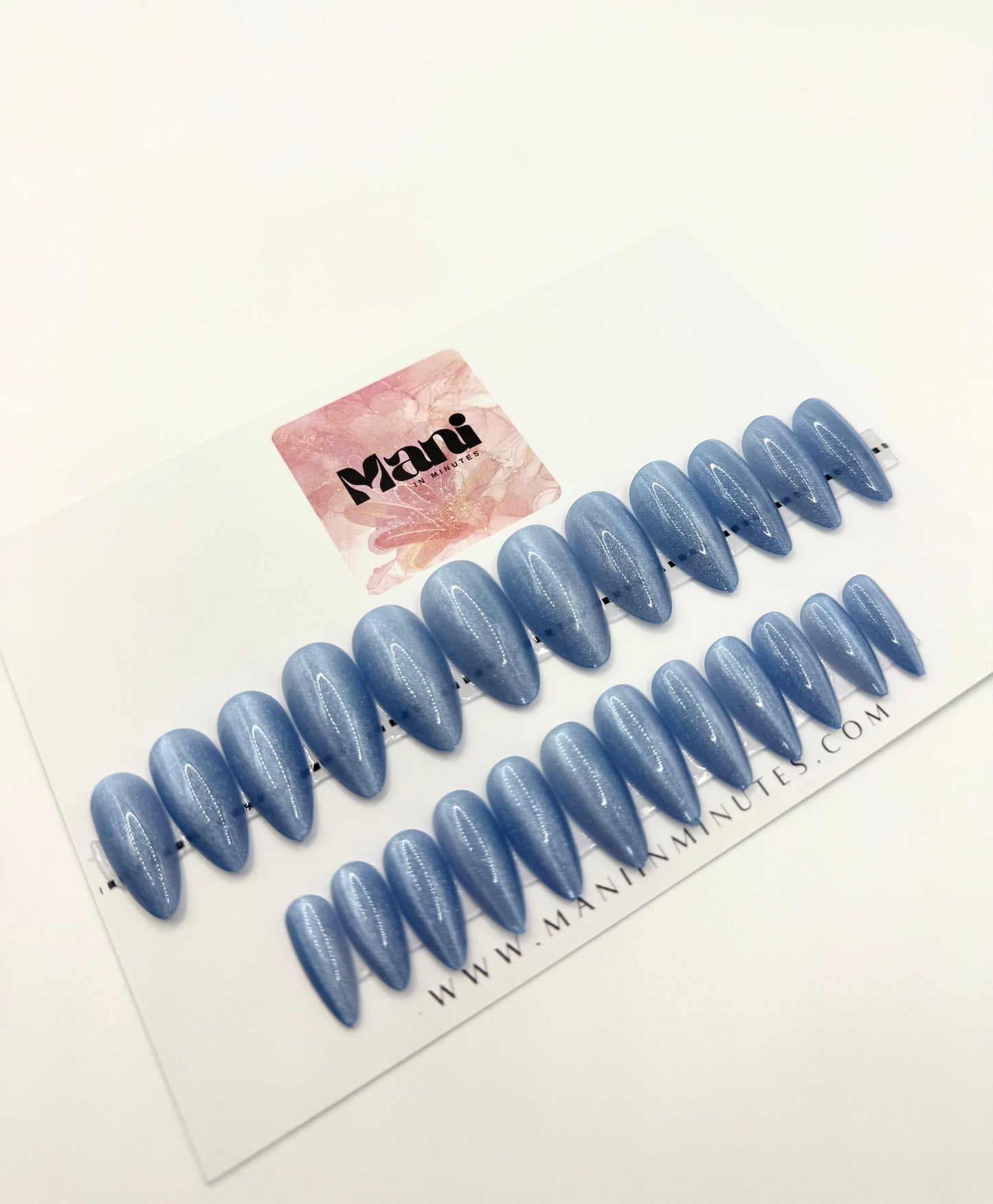 Blue Jean Baby press-on nails displayed on branded Mani in Minutes card.