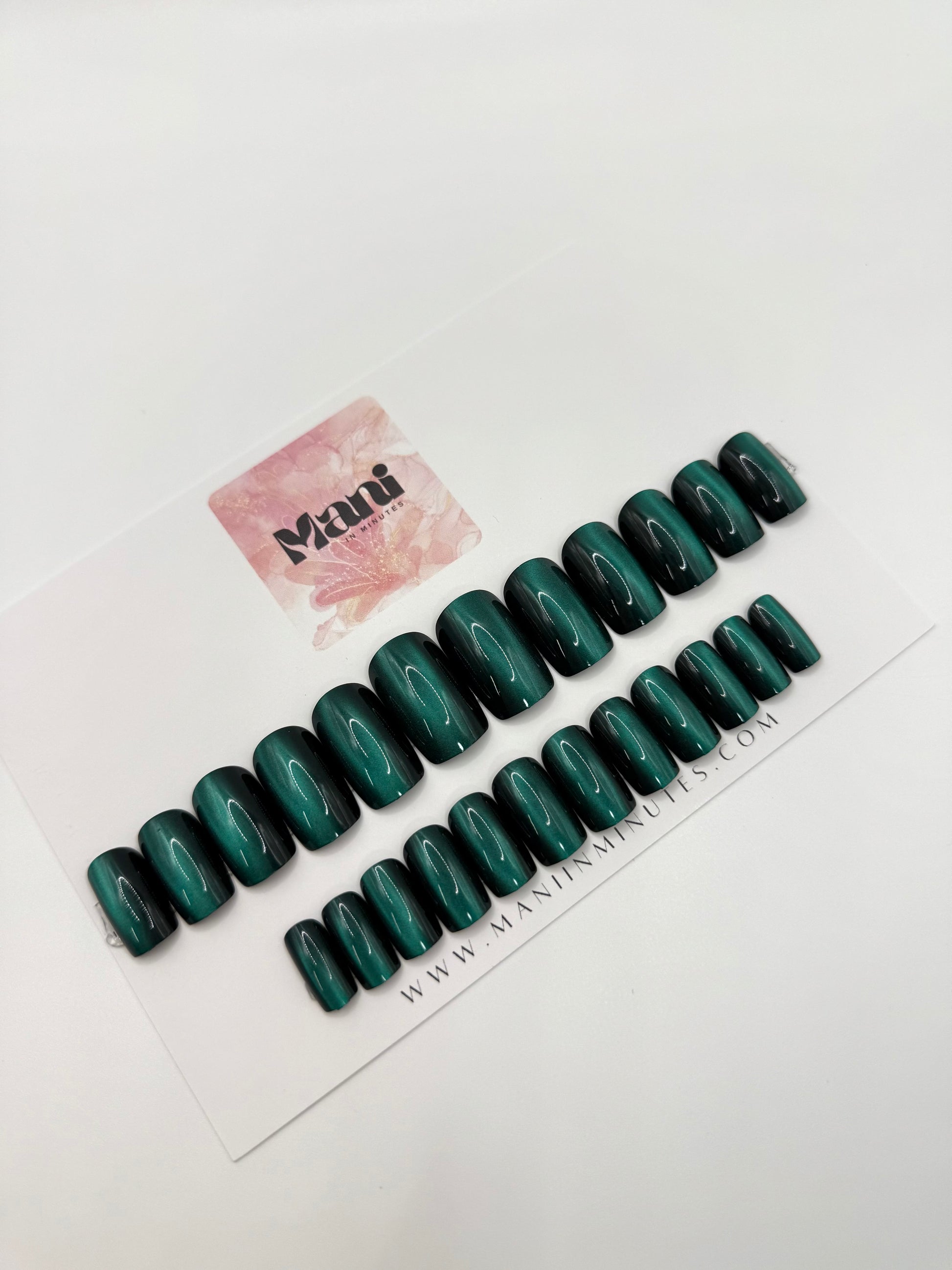 Poison Ivy nail set displayed on Mani in Minutes card – medium square green cat-eye nails