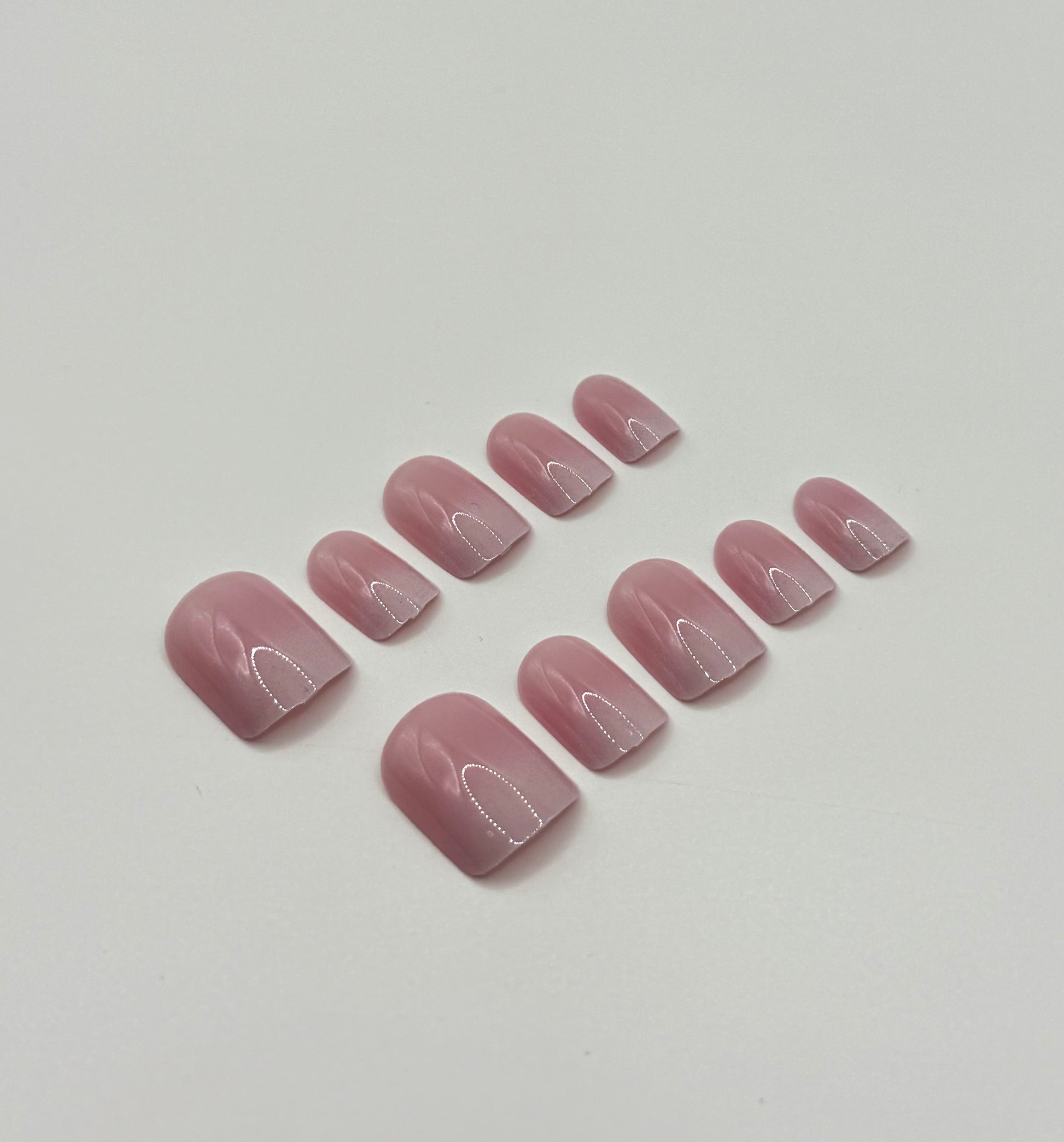 Close-up of Subtle Pink Ombre press-on nails showing delicate blush to pink fade