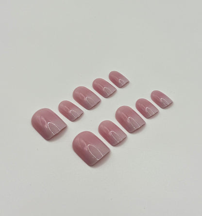 Close-up of Subtle Pink Ombre press-on nails showing delicate blush to pink fade