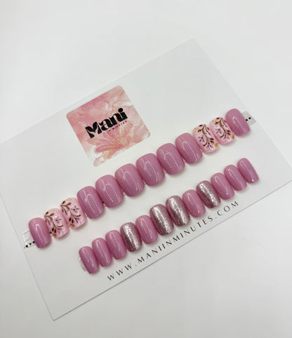 Heirloom Rose nail set displayed on Mani in Minutes card – medium square press-ons in soft pink with shimmer overlay