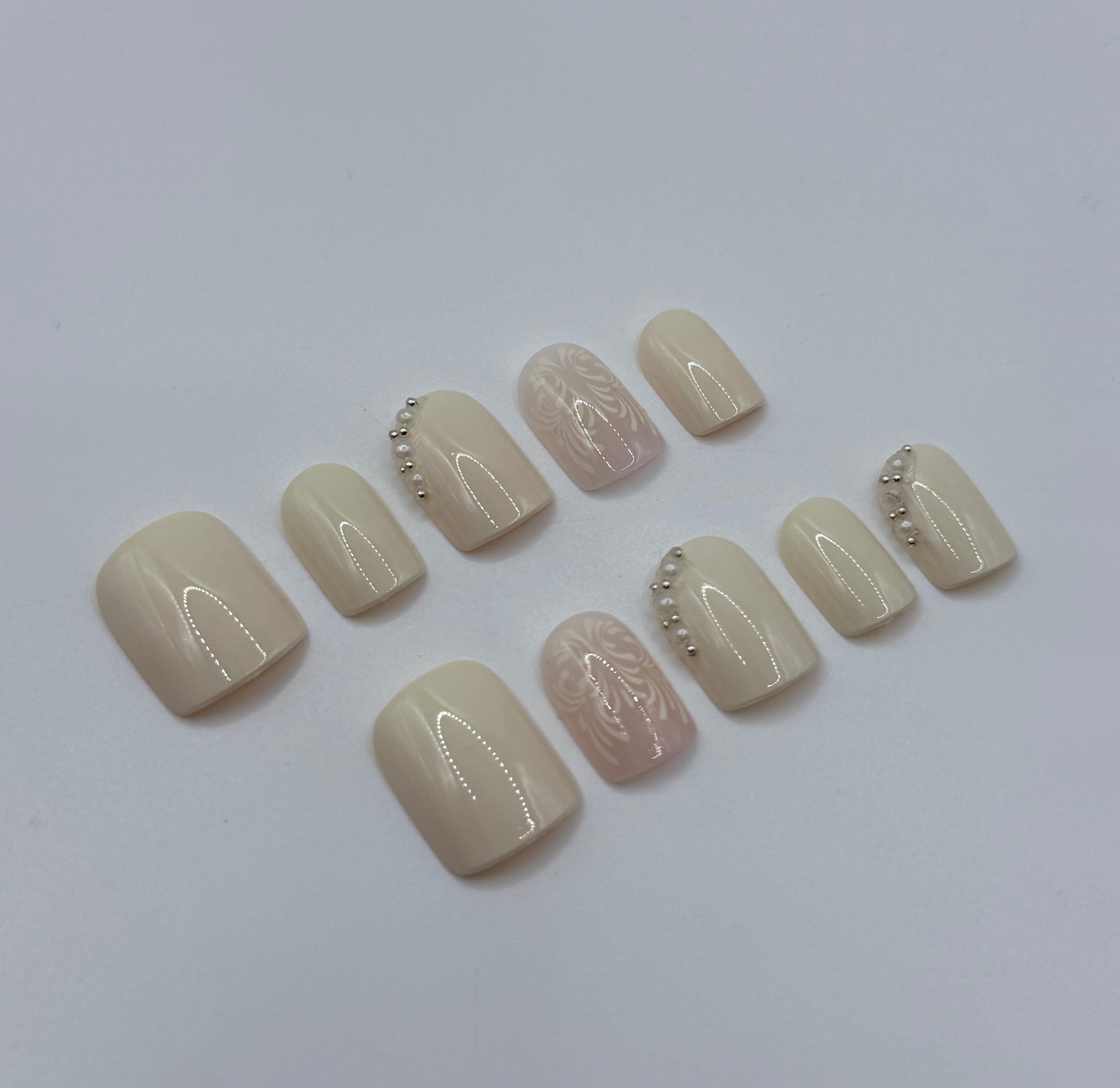 Close up ivory veil press on nails with embellishment 
