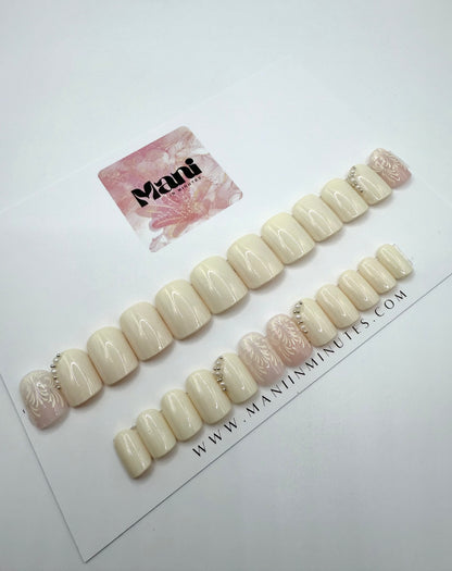 Ivory Veil nails on card with lace and pearl embellishment 
