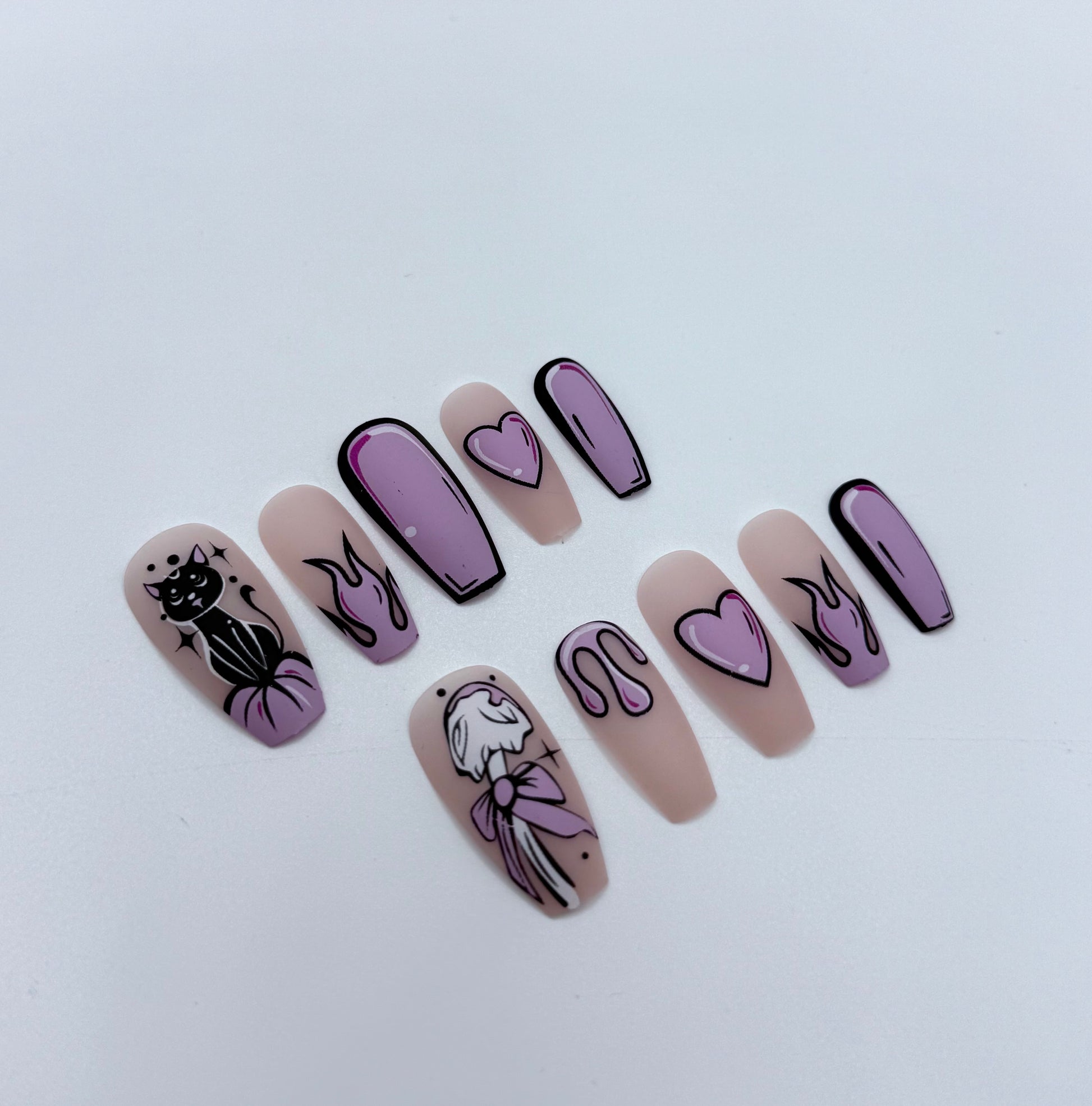 Medium coffin press on nails with cartoon-inspired artwork