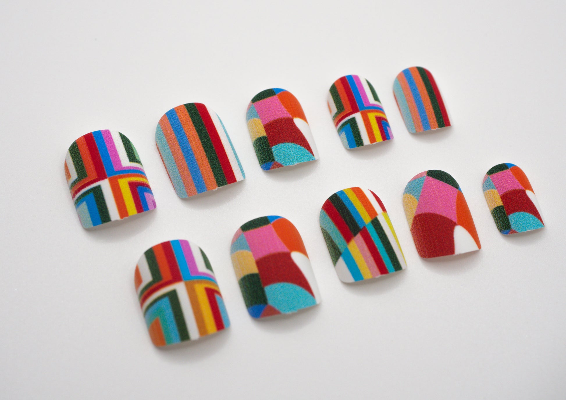 Geometric Glam press-on nails – bold rainbow geometric design by Mani in Minutes
